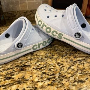 Crocs. Never worn outside- only a few times indoors. Practically new.